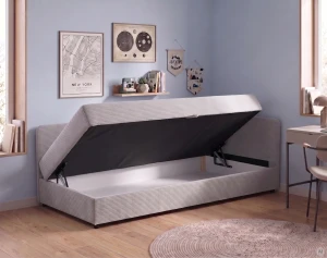 Čalúnená jednolôžková posteľ s úložným priestorom Hirek 90x200 Menčester Krémová